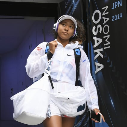 Japan’s Naomi Osaka walks into Margaret Court Arena for her second round singles match against China’s Zheng Saisai at the Australian Open 2020 tennis tournament in Melbourne. Photo: Andy Brownbill