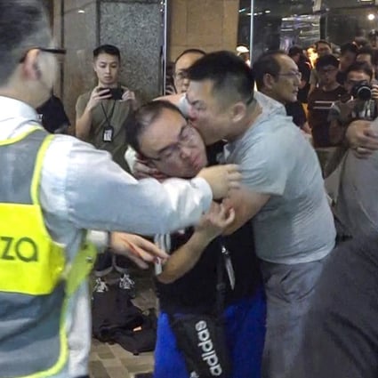 Defendant Joe Chen, found guilty on Wednesday, bites the ear of then district councillor Andrew Chiu in November 2019. Photo: Handout