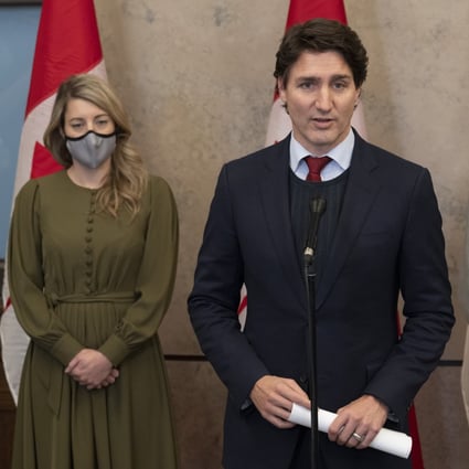 Canadian Prime Minister Justin Trudeau announces Canada will join a diplomatic boycott of the Beijing Winter Olympics over human rights concerns, at a press conference in Ottawa on Wednesday. Looking on are Foreign Affairs Minister Melanie Joly (left) and Sports Minister Pascale St-Onge. Photo: AP