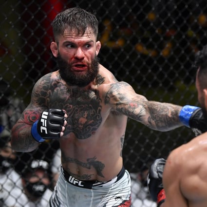 Cody Garbrandt (left) punches Rob Font in their bantamweight bout at a UFC Fight Night. Photo: Zuffa LLC. 