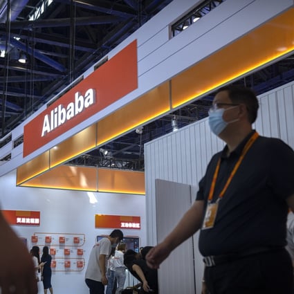 Visitors walk past a booth for Alibaba at the China International Fair for Trade in Services (CIFTIS) in Beijing, Sept. 3, 2021. Photo: AP