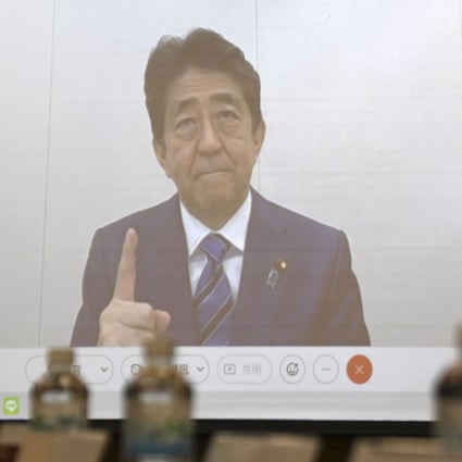 Former Japanese Prime Minister Shinzo Abe, seen on a screen during a meeting in Taipei, has sparked Chinese anger with his comments on Taiwan. Photo: AP