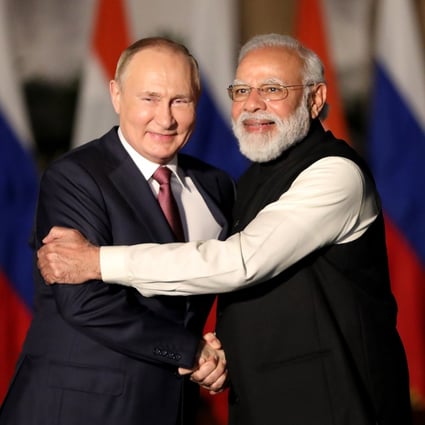 Russian President Vladimir Putin and Indian Prime Minister Narendra Modi embrace in New Delhi. Photo: EPA