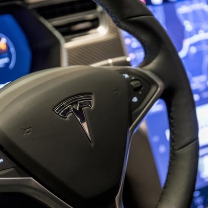 The US National Highway Traffic Safety Administration is looking into a complaint that Tesla drivers can play video games on a dashboard screen while their vehicle is moving. Photo: TNS