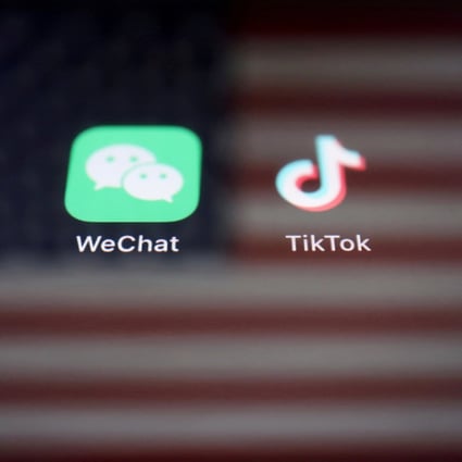 A reflection of the US flag seen on the signs of the WeChat and TikTok apps on September 19, 2020. Photo: Reuters