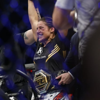 Julianna Pena smiles after defeating Amanda Nunes by submission to become the UFC bantamweight champion. Photo: AP/Chase Stevens