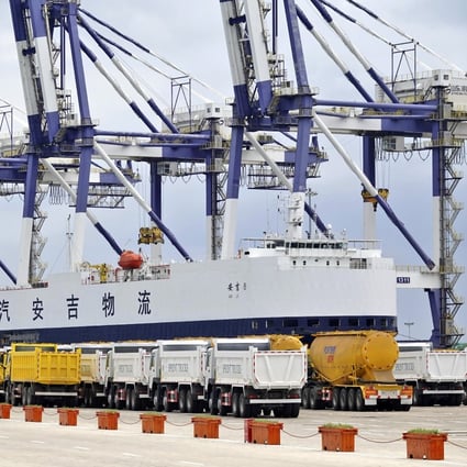 Trucks manufactured for export are lined up at a cargo port in Yantai in eastern China’s Shandong province on July 30. Trade as a percentage of China’s GDP peaked in 2006 at around 64 per cent, but has now fallen back to about 34 per cent. Photo: AP