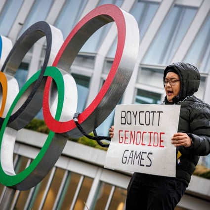 A Tibetan activist from the Students for a Free Tibet association protests in front of the International Olympic Committee (IOC) headquarters in Lausanne, Switzerland on Saturday. Photo: AFP