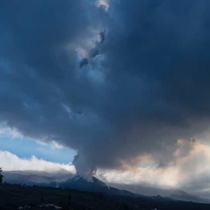 The Cumbre Vieja volcano, pictured from El Paso, spews ash and smoke on the Canary island of La Palma on Sunday. Photo: AFP