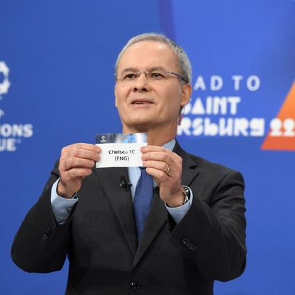 Uefa deputy general secretary Giorgio Marchetti pulls out the card of Chelsea during the first attempted draw. Photo: Reuters