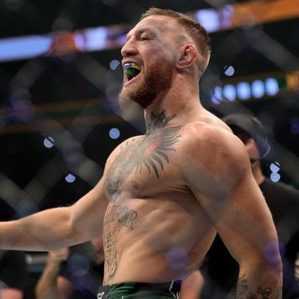 Conor McGregor walks in the Octagon before his lightweight bought against Dustin Poirier at UFC 264. Photo: AFP