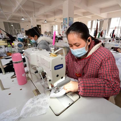 Workers at a clothing manufacturer in Jianhe County, southwest China’s Guizhou Province, March 1, 2020. Photo: Xinhua
