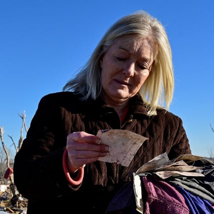 Laura Croft searches through debris in Dawson Springs, Kentucky, on Monday, near where her mother and aunt were found dead after tornadoes ripped through several US states. Photo: Reuters
