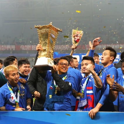 In better times: Wu Jingui holds the trophy after winning the Chinese FA Cup with Shanghai Shenhua in 2017. Photo: AFP