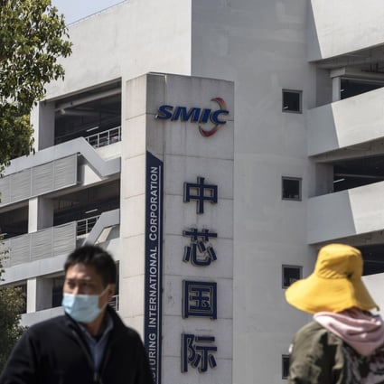 Pedestrians walk past Semiconductor Manufacturing International Corp (SMIC) headquarters in Shanghai on March 23. SMIC could soon face additional restrictions from Washington, frustrating efforts by Beijing to boost its semiconductor industry. Photo: Bloomberg