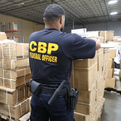 Customs and Border Protection officers at the Port of New York/Newark inspect a shipment of imports from China, some of which are suspected to have been made with forced labour. Photo: Handout