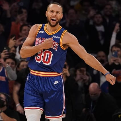 Golden State Warriors guard Stephen Curry reacts after scoring a 3-point basket during the first half of an NBA game against the New York Knicks. Photo: AP