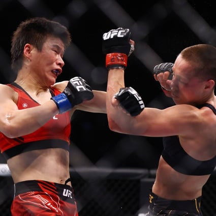 Rose Namajunas punches Zhang Weili in their strawweight title bout at UFC 268. Photo: AFP