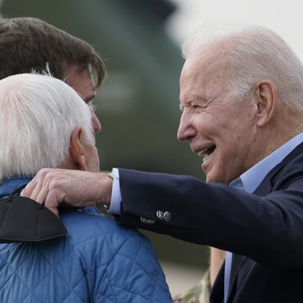 US President Joe Biden greets former governor Steve Beshear, (second from left), Kentucky Governor Andy Beshear and his wife, Britainy Beshear as he arrives in Fort Campbell, Kentucky on Wednesday. Photo: AP