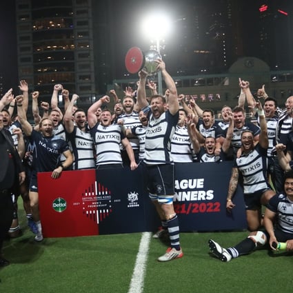 Hong Kong Football Club skipper Josh Hrstich lifts the Dettol Men’s Premiership trophy after his side’s 49-13 win over Kowloon at Happy Valley. Photo: Jonathan Wong
