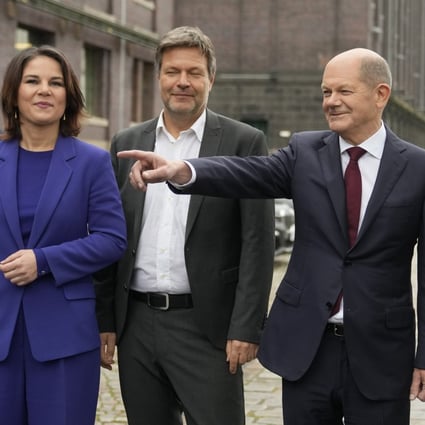 Newly-elected German Chancellor and Social Democrat leader Olaf Scholz (second right) with coalition partners (from left) Annalena Baerbock and Robert Habeck of the Green Party and Christian Lindner of the Free Democrats. Photo: AP 