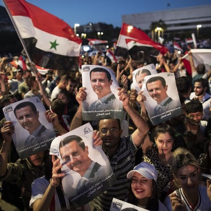 Supporters of Syrian President Bashar al-Assad in Omayyad Square, Damascus. Photo: AP