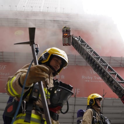 An electrical fire broke out in Hong Kong’s World Trade Centre, injuring at least 13 people and trapping hundreds on the fifth-floor podium and the rooftop. Photo: Sam Tsang