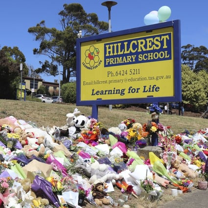 Flowers and tributes are seen outside Hillcrest Primary School in Tasmania. Photo: AAP Image via AP 