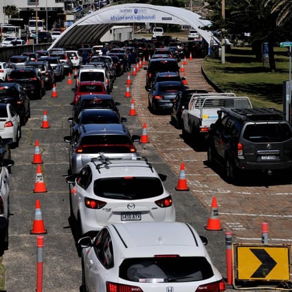 People queue in cars at Bondi Beach in Sydney to get tested for Covid-19. Photo: AFP