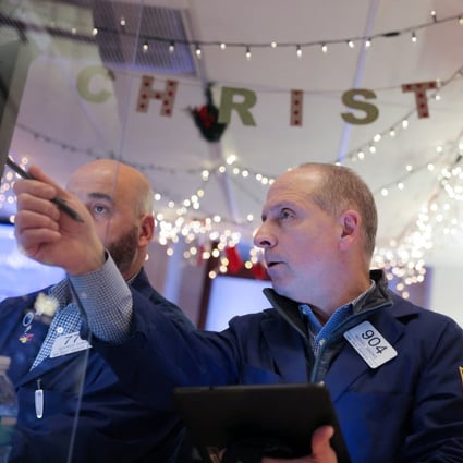 Traders work at the New York Stock Exchange in Manhattan on December 17, 2021. China’s securities regulator and American authorities have initiated talks on the audit inspection of US-listed Chinese companies amid the potential delisting of these firms. Photo: Reuters 