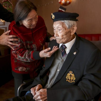 Yeung Ming-hon, 98, one of two remaining survivors of the Battle of Hong Kong, with his  his 92-year-old wife Yeung Yu Yee-fan at the Chinese Recreation Club in Tai Hang. Photo: Jonathan Wong
