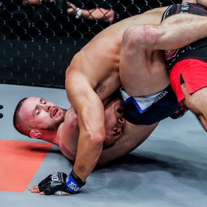 Vitaly Bigdash submits Fan Rong with a third-round guillotine choke. Photos: Dux Carvajal/ONE Cahmpionship
