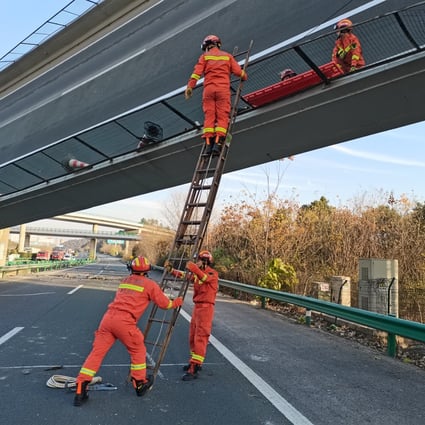 Emergency workers attend the scene of a fatal expressway flyover collapse in Ezhou on Saturday. Photo: Xinhua