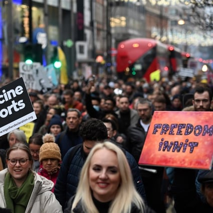 Protesters march against Covid-19 restrictions in London on Saturday. Photo: EPA