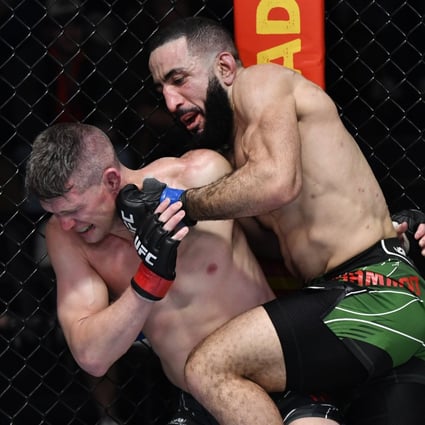 Belal Muhammad punches Stephen Thompson in their welterweight fight at UFC Vegas 45. Photo: Jeff Bottari/Zuffa LLC