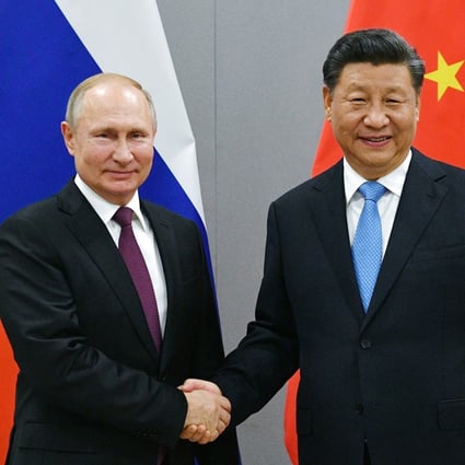 Russian President Vladimir Putin and Chinese President Xi Jinping shake hands prior to their talks on the sideline of the the BRICS Summit in Brazil in 2019. Photo: AP