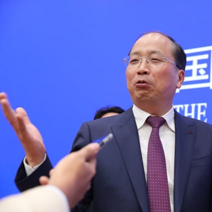 Yi Huiman, chairman of China Securities Regulatory Commission, has said China’s regulatory system is being improved. Photo: Simon Song
