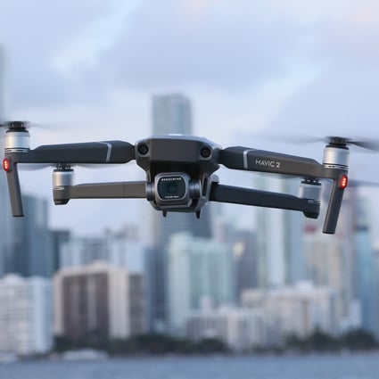 In this photo illustration, a DJI Mavic 2 Pro made by the Chinese drone maker hovers in place on December 15 in Miami, Florida. Photo: AFP