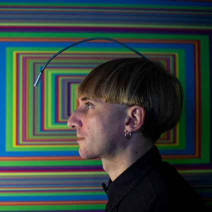 “Cyborg” artist Neil Harbisson designed an antenna to overcome his colour blindness that lets him hear colours through bone conduction, allowing him to paint portraits - including those of actors Tom Cruise and Leonardo DiCaprio. Photo: Josep Lago/AFP