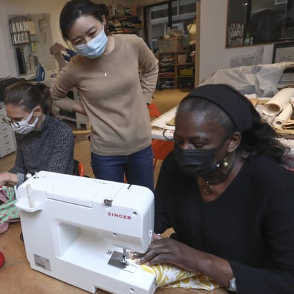 Melanie Bell (right) is the founder of The Sewing Lounge in Sheung Wan. Hongkongers like Kim Su-woon (standing), unable to travel, are taking up new hobbies like sewing. Photo: Jonathan Wong