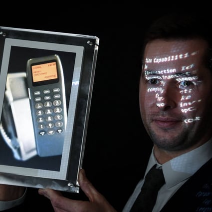 A phone with the world’s first SMS, which was auctioned at the Aguttes auction house in Paris. Photo: AFP / DPA