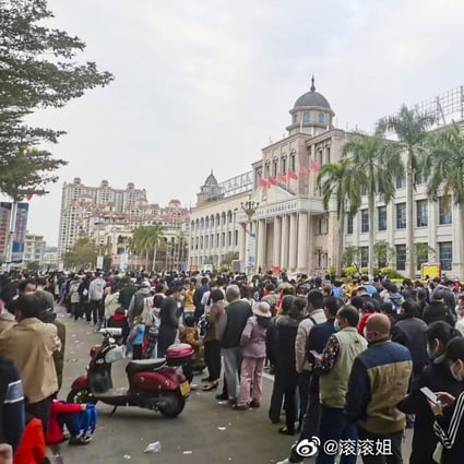 People queue for mass Covid-19 testing in Dongxing, where strict measures have been imposed. Photo: Weibo