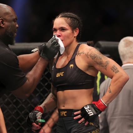Amanda Nunes of Brazil is attended to following her loss to Julianna Pena at UFC 269. Photo: Carmen Mandato/Getty Images/AFP