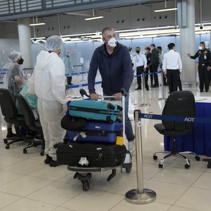 A tourist arrives at Suvarnabhumi International Airport in Bangkok, Thailand. Photo: AP