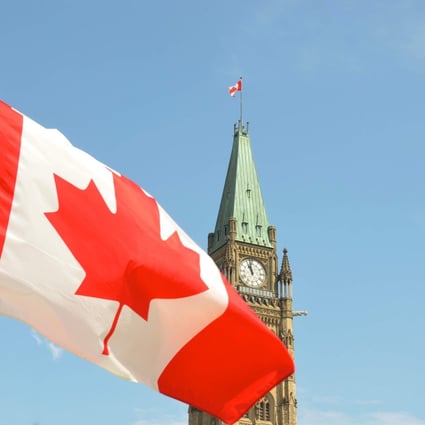 The Canadian flag waves in front of the Parliament Building on Parliament Hill in Ottawa, in this file photo. Photo: Jason Hafso/Unsplash