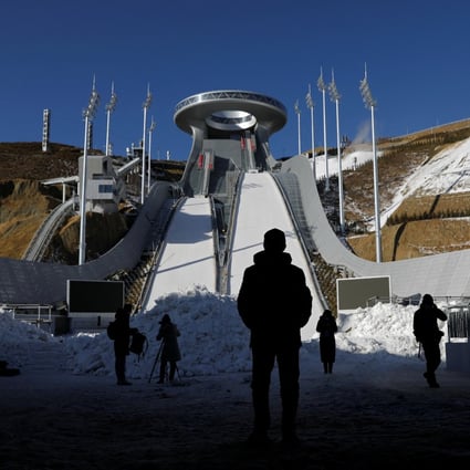 Journalists stand at the National Ski Jumping Centre during a government-organised media tour to Beijing 2022 Winter Olympics venues in Zhangjiakou, Hebei province, on  December 21, 2021. Photo: Reuters