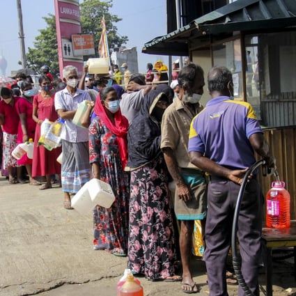 People queue to buy kerosene in Colombo on Thursday. Retail inflation in Sri Lanka jumped to 9.9 per cent in November, a 12-year high. Photo: AFP