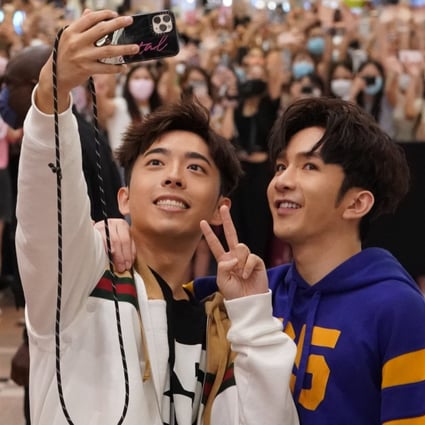 Edan Lui (left) and Anson Lo of boy band Mirror meet their adoring fans at a Gucci store in Harbour City, Tsim Sha Tsui. Luxury brands have flocked to use the Canto-pop group’s fame and popularity in marketing campaigns in 2021. Photo: Felix Wong