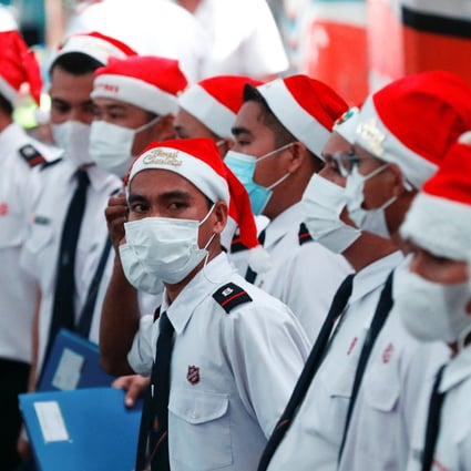 Members of a choir get ready to sing Christmas songs in Jakarta, Indonesia, on Wednesday. Photo: Reuters