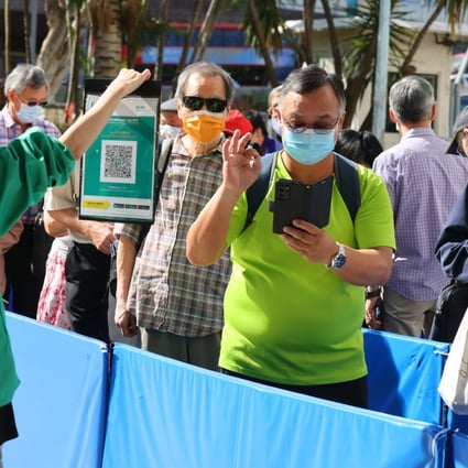 Eligible residents queue for BioNTech booster shots last month at the Sun Yat Sen Memorial Park Sports Centre. Photo: Dickson Lee